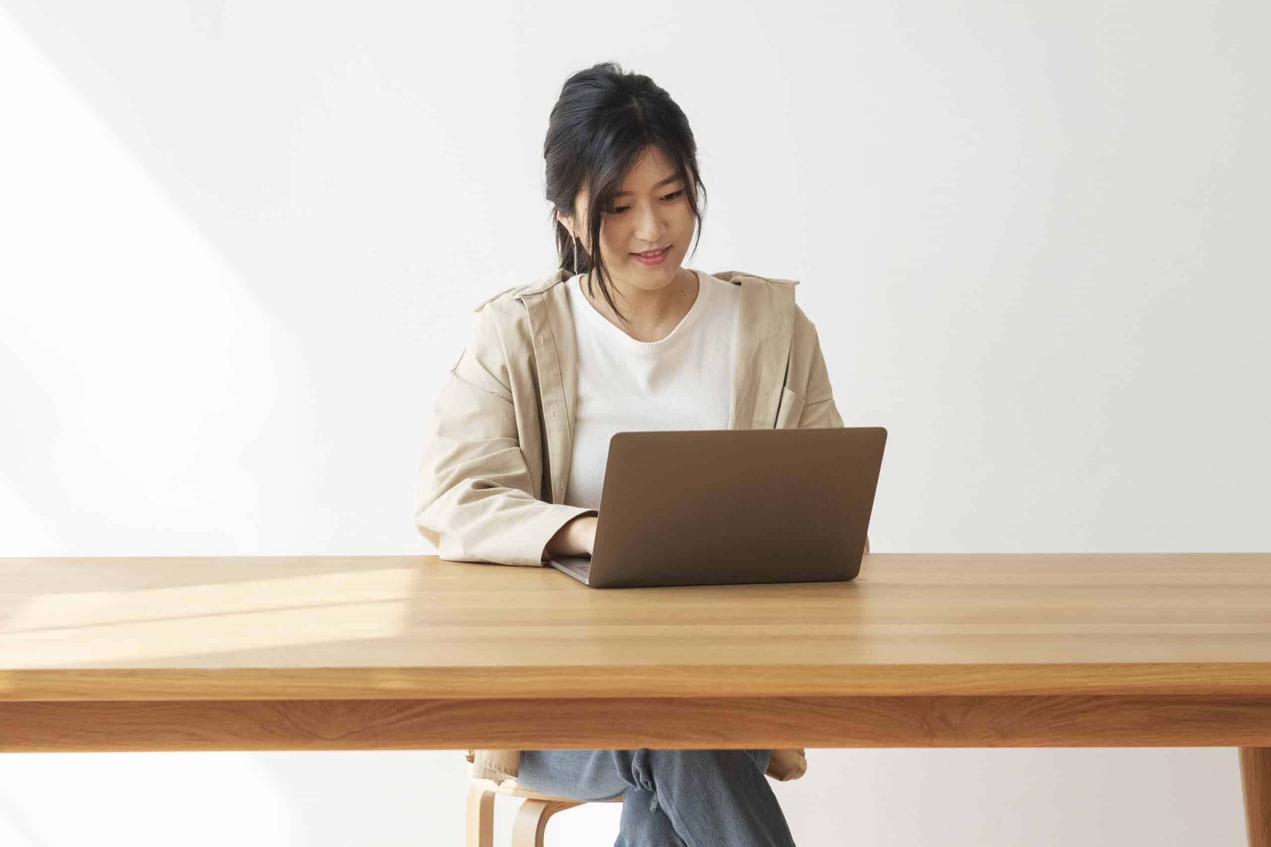 Happy Asian woman working from home