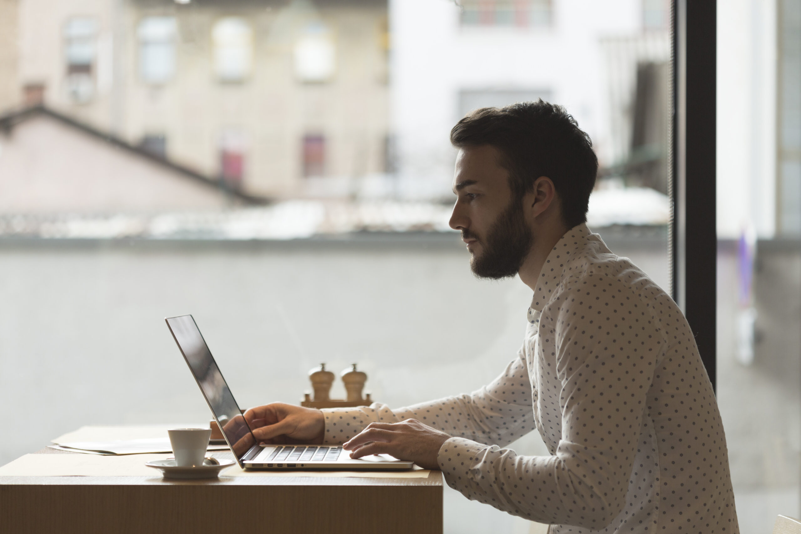 side-view-entrepreneur-working-laptop