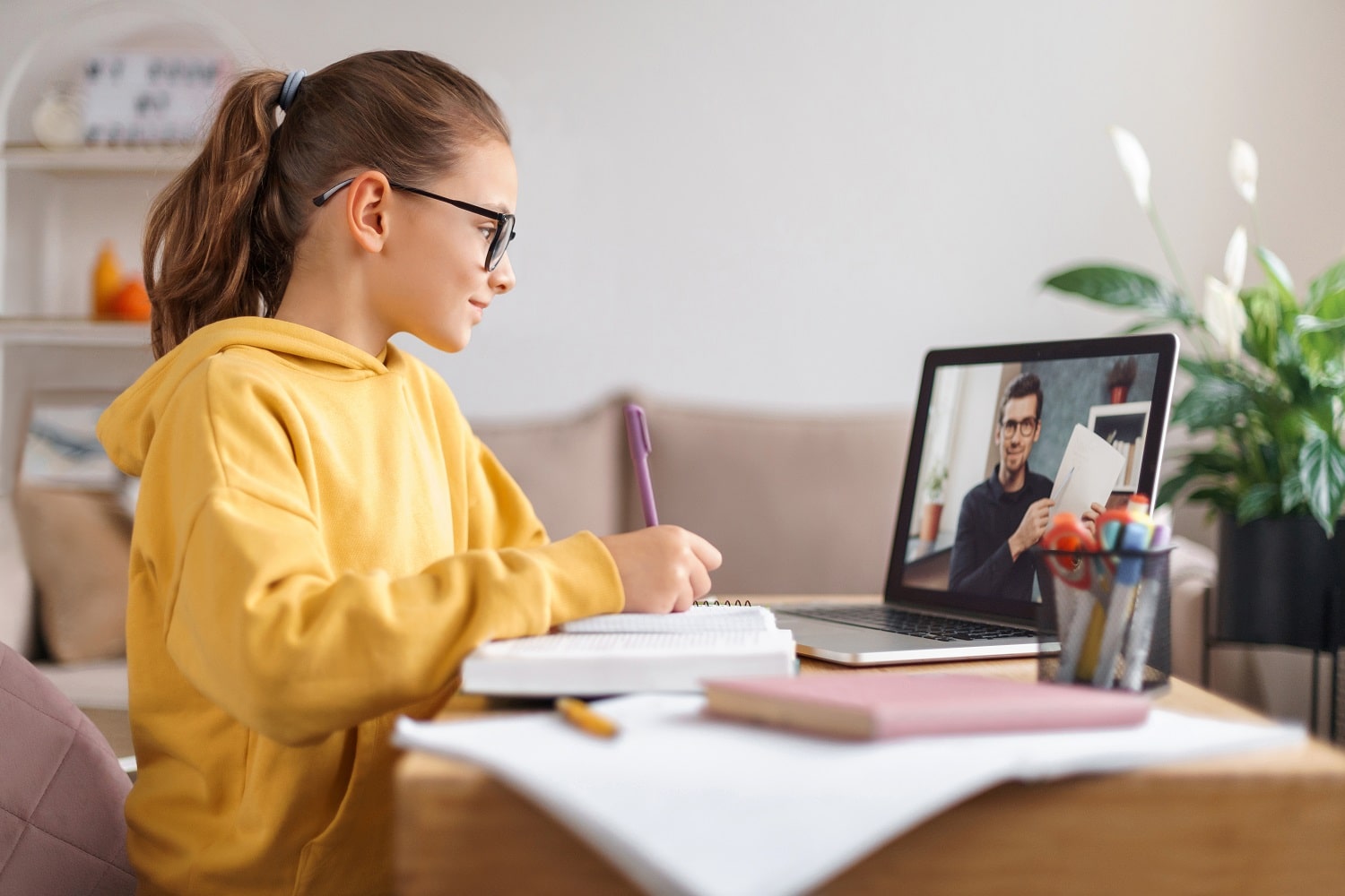 Tutor conducts online class for hia pupil